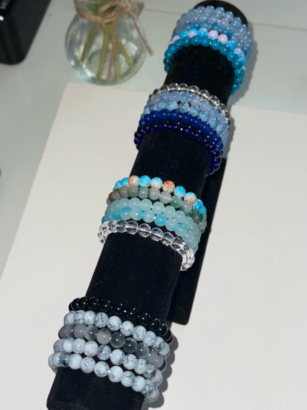 Multi-colored beaded bracelets with pink, red, yellow, blue, black